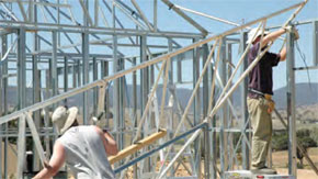 Owner builders lifting steel roof frame