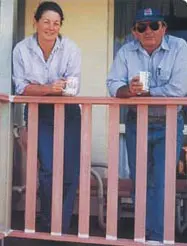 Colin and Leigh on verandah with coffee