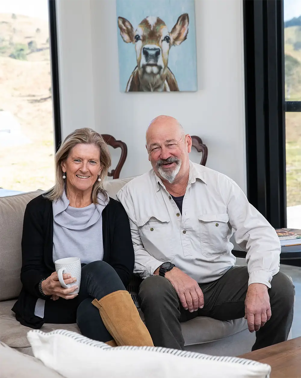 Greg and Lisa Wyatt Spratt sitting inside of their new kit home