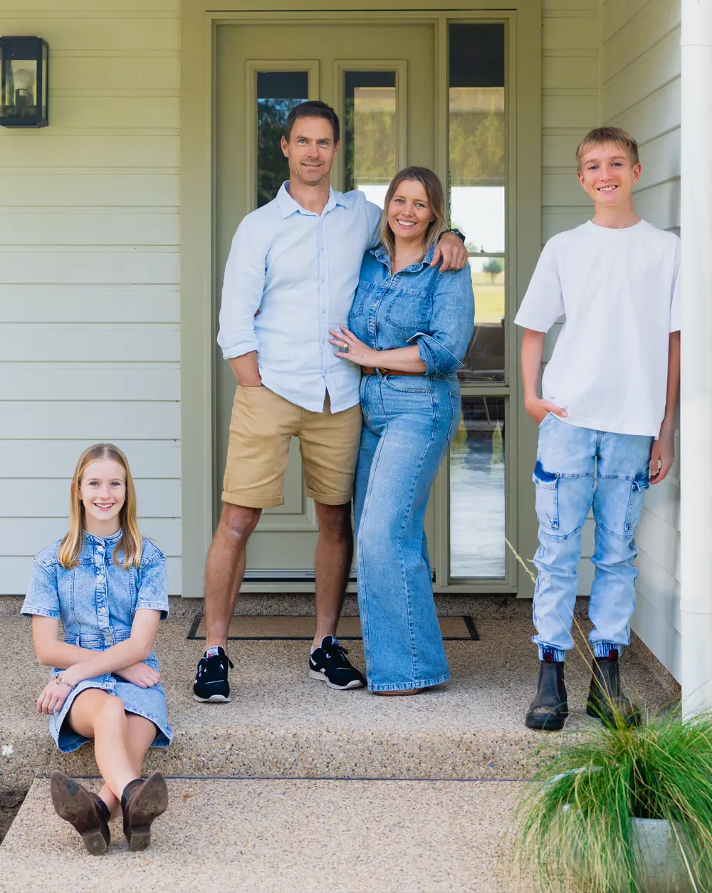 Roberts family in front of their new kit home