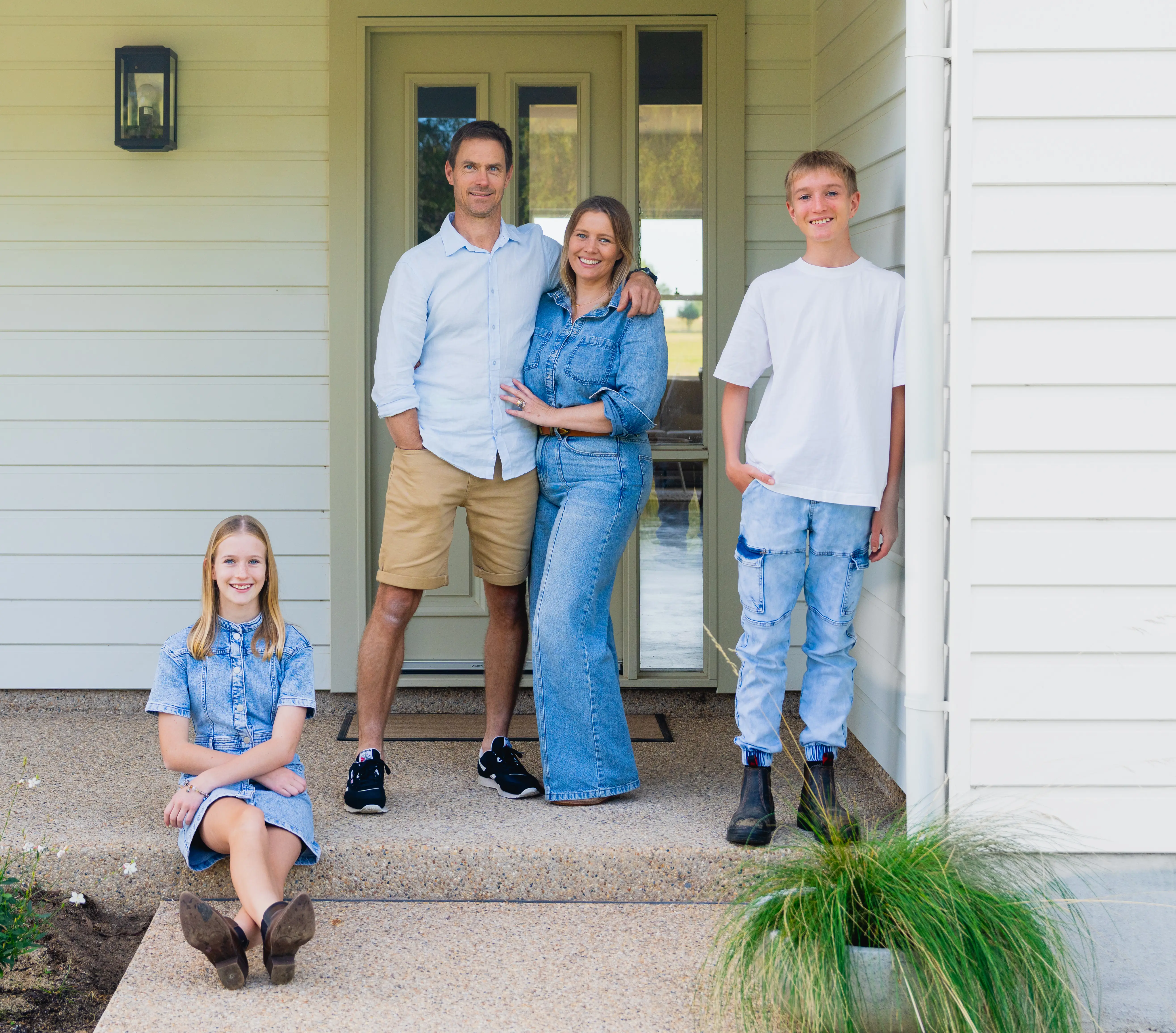 Roberts family infront of their new home