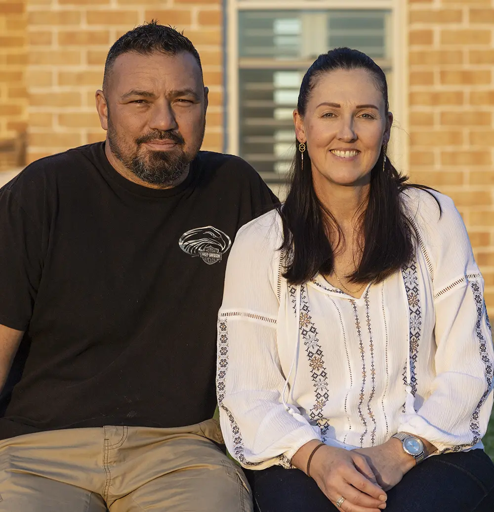 Frank and Catherine Sant in front of their completed kit home home in Cattai