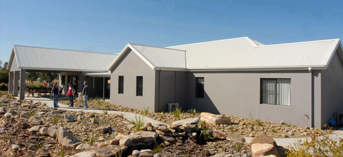 After all their building work, Patrick, Glenda and their two daughters are now enjoying the luxury of their new kit home, with a spacious kitchen, four bedrooms all with ensuites, a billiard room and a guest room