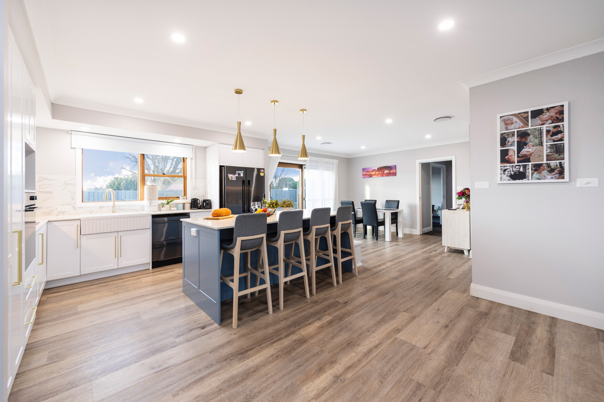 Kitchen and dinning showing island and timber flooring